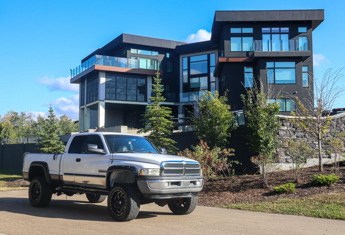 Truck parked in front of a gorgeous house